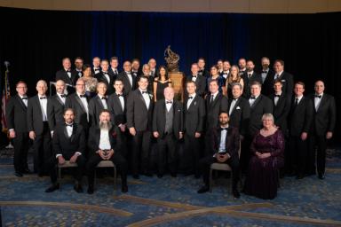 Members of NASA's Ingenuity Mars Helicopter team are pictured with the Collier Trophy during the Robert J. Collier Dinner in Washington on June 9, 2022.