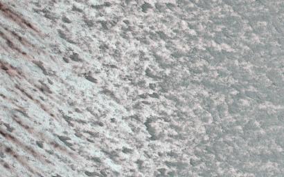 This image acquired on January 20, 2022 by NASA's Mars Reconnaissance Orbiter shows rapid albedo (brightness) changes at this time of year (late northern summer) on the Martian polar cap.
