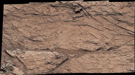 NASA's Curiosity Mars rover captured evidence of layers that built up as windblown sand both accumulated and was scoured away at a location nicknamed Las Claritas. This image was captured using Curiosity's Mast Camera, or Mastcam, on May 19, 2022.
