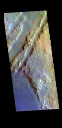 This image from NASA's Mars Odyssey shows linear depressions that are part of Nili Fossae. Nili Fossae is a collection of curved faults and down-dropped blocks of crust between the faults.
