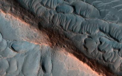 This image acquired on March 28, 2022 by NASA's Mars Reconnaissance Orbiter shows a ridge standing prominently in this scene, left behind as the surroundings were eroded, perhaps marking inverted erosion of an ancient fluvial channel.
