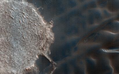 This image acquired on December 13, 2017 by NASA's Mars Reconnaissance Orbiter shows mega-ripples collecting along the flanks of the dark sand dunes near the North Polar deposits.