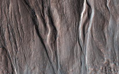 This image acquired on May 29, 2022 by NASA's Mars Reconnaissance Orbiter shows (part of) a 6-kilometer crater located on the northern slope of Bond Crater.