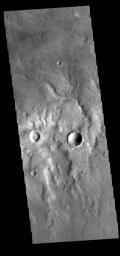 This image from NASA's Mars Odyssey shows several channels. These unnamed channels are flowing downhill into the northern part of Bosporos Planum.