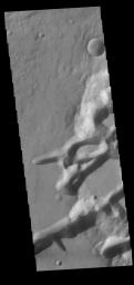 This image from NASA's Mars Odyssey shows Mangala Fossae, a long linear depression called a graben, formed by extension of the crust and faulting.