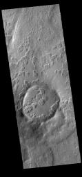 This image from NASA's Mars Odyssey shows an unusual layer of smooth material covering the flanks of the volcano Peneus Patera, located south of the Hellas Basin.