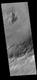 This image from NASA's Mars Odyssey shows an unnamed crater in Noachis Terra. This crater has a pit in the center of the floor of the crater.