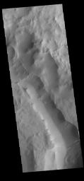 This image from NASA's Mars Odyssey shows Maunder Crater. Its floor has been filled by a significant amount of material.