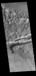 This image from NASA's Mars Odyssey shows part of Mangala Fossae. Fossae are long linear depressions called a graben and were formed by extension of the crust and faulting.
