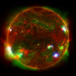 This composite image of the Sun includes high-energy X-ray data from NASA's NuSTAR shown in blue; lower energy X-ray data from the XRT on the JAXA's Hinode mission shown in green; and ultraviolet light detected by the AIA on NASA's SDO shown in red.
