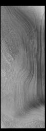 This image from NASA's Mars Odyssey shows layering in the south polar cap. The layers are formed over thousands of years of seasonal change, reflecting ice and dust surface deposition.