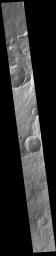 This image from NASA's Mars Odyssey shows linear features, part of Mangala Fossae. Mangala Fossae are long linear depressions called a graben and were formed by extension of the crust and faulting.