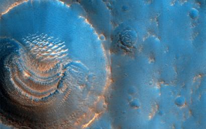 This image acquired on October 23, 2022 by NASA's Mars Reconnaissance Orbiter shows the northern plains of Arabia Terra, with craters that contain curious deposits with mysterious shapes and distribution.