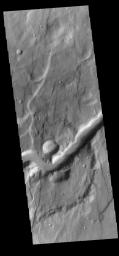 This image from NASA's Mars Odyssey shows an unnamed channel located in Claritas Fossae. The channel flows from the highland of the fossae down into Icaria Planum.