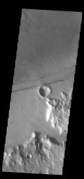 This image from NASA's Mars Odyssey shows a linear feature, a tectonic graben, part of Sirenum Fossae.