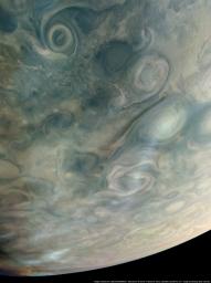 As NASA's Juno spacecraft flew low over the giant planet's cloud tops, its JunoCam instrument captured this look at bands of high-altitude haze forming above cyclones in an area known at Jet N7.