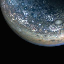 The JunoCam instrument aboard NASA's Juno spacecraft captured this color-enhanced view of the giant planet's northern hemisphere, during its 61st close flyby of Jupiter on May 12, 2024.