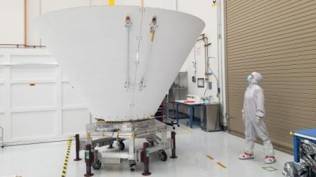 Sara Susca, deputy payload manager and payload systems engineer for NASA's SPHEREx mission, looks up at one of the spacecraft's photon shields. These concentric cones protect the telescope from light and heat from the Sun and the Earth.