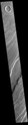 This image from NASA's Mars Odyssey shows a portion of Tempe Fossae. The fossae are graben comprised of paired, parallel fractures with a down-dropped block of material between the fracture set.