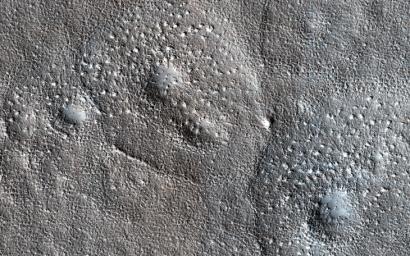 This image acquired on January 2, 2023 by NASA's Mars Reconnaissance Orbiter shows expanded craters with an unusually bumpy texture in the outer apron where sublimation occurred.