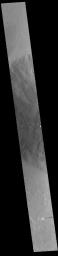 This image from NASA's Mars Odyssey shows the western flank of Ceraunius Tholus. At only 128 km (79 miles) across, it is one of the smaller Tharsis volcanoes.