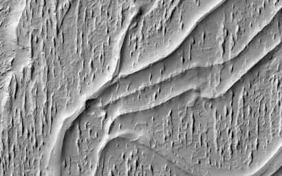 This image acquired on July 3, 2023 by NASA's Mars Reconnaissance Orbiter shows multiple processes, which may have occurred billions of years apart, reflected in this HiRISE image of Aeolis Planum.
