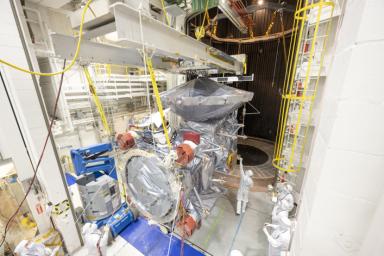 NASA's Europa Clipper is seen being lifted into the Space Simulator at JPL in February, 2024. Thermal vacuum testing, which lasted 16 days, ensures that the spacecraft will withstand the harsh conditions of space.
