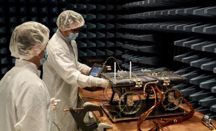 A CADRE rover is prepared for electromagnetic interference and compatibility testing in a special chamber at JPL in November 2023.