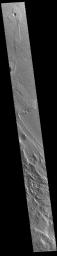 This image from NASA's Mars Odyssey shows part of Aeolis Planum. The surface in this region has been heavily eroded by wind action.