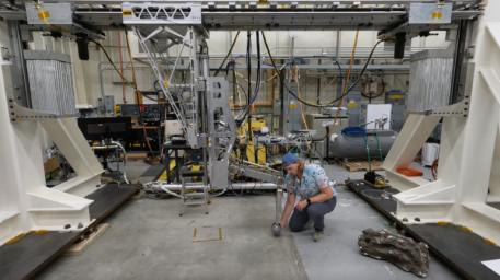 Engineer Matthew Cameron-Hooper performs a checkout on some systems of the Europa Lander landing gear testbed at NASA's Jet Propulsion Laboratory in Southern California on May 27, 2022.