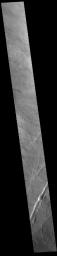 This image from NASA's Mars Odyssey shows linear features called Oti Fossae. Oti Fossae is located on the eastern flank of Arsia Mons and aligns with the regional northeast/southwest trend of the major Tharsis volcanoes.