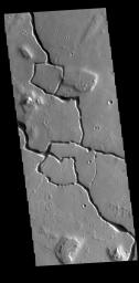 This image from NASA's Mars Odyssey shows part of Hephaestus Fossae. Hephaestus Fossae is a complex channel system in Utopia Planitia near Elysium Mons.