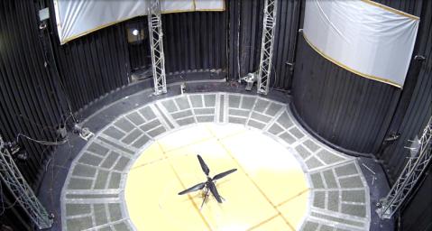 This image shows a test flight of a full-scale prototype of the Ingenuity Mars Helicopter.