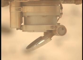 The cover for the Autofocus and Context Imager camera on SHERLOC is seen moving in images captured by the rover's Mastcam-Z instrument on May 11, 2024.