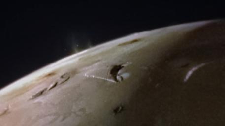 The JunoCam instrument aboard NASA's Juno spacecraft captured two volcanic plumes rising above the horizon of Jupiter's moon Io. The image was taken Feb. 3, 2024, from a distance of about 2,400 miles (3,800 kilometers).