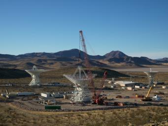 After the steel framework of the Deep Space Station 23 reflector dish was lowered into place on Dec. 18, 2024, a crew installed the quadripod, a four-legged support structure.