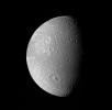 Many impact craters -- the record of the collision of cosmic debris -- are shown in this mosaic from NASA's Voyager 1 of Saturn's moon Dione.