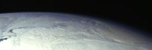 This color picture of the limb of the Earth, looking north past Antarctica, is a mosaic of 11 images taken during a ten-minute period near 5:45 p.m. PST Dec. 8, 1990, by NASA's Galileo's imaging system.