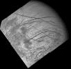 Dark crisscrossing bands on Jupiter's moon Europa represent widespread disruption from fracturing and the possible eruption of gases and rocky material from the moon's interior in this four-frame mosaic of images from NASA's Galileo spacecraft.