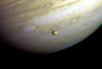 This photograph of the southern hemisphere of Jupiter was obtained by NASA's Voyager 2 on June 25, 1979. Seen in front of the turbulent clouds of the planet is Io, the innermost of the large Galilean satellites of Jupiter.