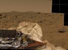NASA's Mars Pathfinder took this image of surrounding terrain in the mid-morning on Mars (2:30 PM Pacific Daylight Time) in 1997. Part of the small rover, Sojourner, is visible on the left side of the picture.