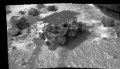 The image on Mars was taken by NASA's Imager for Mars Pathfinder (IMP) on July 8, 1997. The rover Sojourner has traveled to an area of soil and several rocks. Its tracks are clearly visible in the soft soil seen in the foreground.