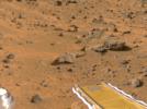 NASA's Mars Pathfinder's forward rover ramp can be seen successfully unfurled in this color image, taken at the end of July 6, 1997 by the Imager for Mars Pathfinder (IMP). he square at the end of the ramp is one of the spacecraft's magnetic targets.