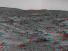An area of rough Martian terrain is prominent in this stereo image, taken by NASA's Mars Pathfinder on Sol 3, 1997. 3D glasses are necessary to identify surface detail. The large rock dubbed 'Wedge' is at lower right.