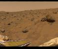This portion of the 360-degree gallery panorama shows NASA's Pathfinder's rear ramp, the rock 'Barnacle Bill' at left, and leading up to the large rock 'Yogi' are the rover's tracks.