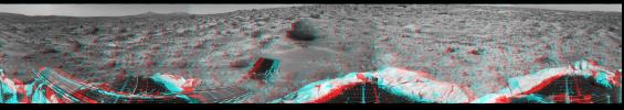 This 360-degree panorama was taken by NASA's Mars Pathfinder. Three petals and the perimeter of the deflated airbags are seen in the foreground. 3D glasses are necessary to identify surface detail. 