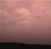 Pink stratus clouds are coming from the northeast at about 15 miles per hour at an approximate height of ten miles above the surface. The image was taken by NASA's Imager for Mars Pathfinder (IMP) on Sol 16. Sol 1 began on July 4, 1997.