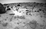 One of the two forward cameras aboard NASA's Sojourner imaged this area of Martian terrain on Sol 26. The large rock dubbed 'Pooh Bear' is at far left, and stands between four and five inches high. Sol 1 began on July 4, 1997.