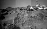 This image was taken by NASA's Sojourner rover's right front camera on Sol 33. The rock in the foreground, nicknamed 'Ender,' is pitted and marked by a subtle horizontal texture. Sol 1 began on July 4, 1997.