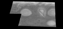 This mosaic shows the features of Jupiter's main visible cloud deck and upper-tropospheric haze, with higher features enhanced in brightness over lower features as seen by NASA's Galileo orbiter on February 19, 1997.